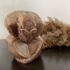 Wood Statue of a Man Crying